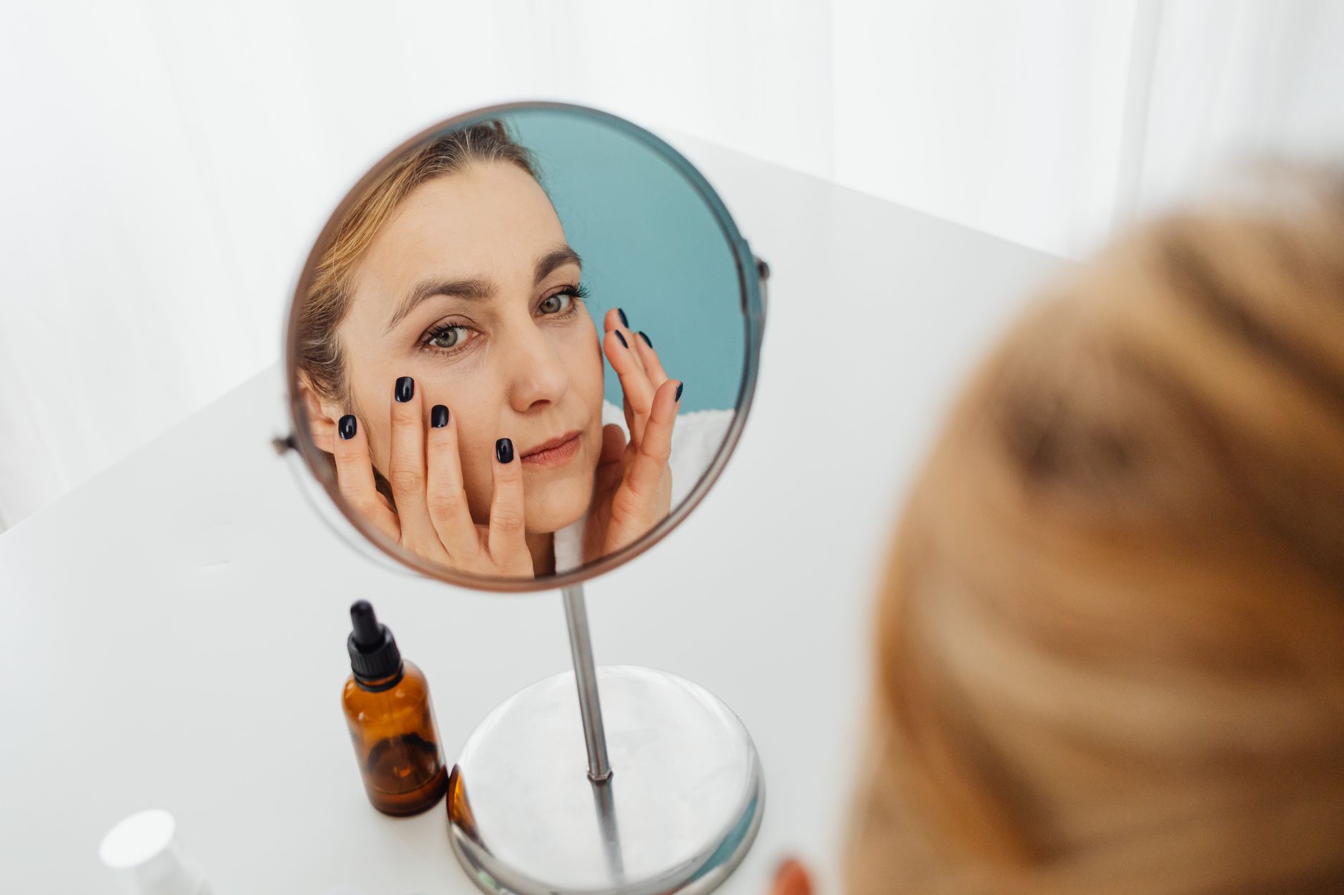 Two skincare bottles labeled retinol and retinal on a bathroom counter